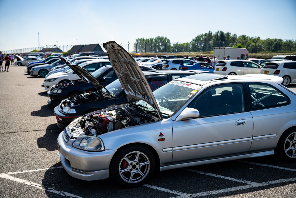 honda civic on display with bonnet up